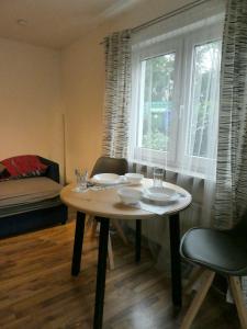 a table and chairs in a room with a window at Ferienwohnung Wanderparadies Neuwied-Heimbach in Neuwied