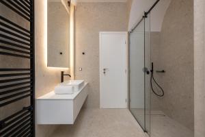 a bathroom with a sink and a shower at Upscale Athens Luxury Penthouse in Athens