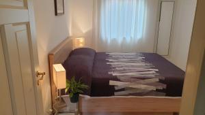 Posteľ alebo postele v izbe v ubytovaní Apartments Aurora Borik