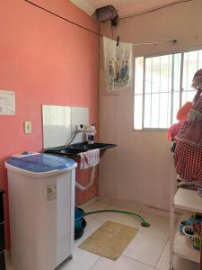 a kitchen with a sink and a counter in a room at Casa alto da Boa Vista in Maragogi