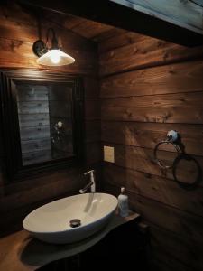 a bathroom with a white sink and a mirror at Kominka Washinkan - Vacation STAY 13791 in Yaita