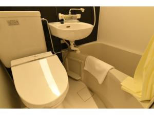 a bathroom with a toilet and a sink at Hotel Wisteria NARA - Vacation STAY 99261v in Nara