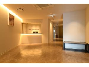 an empty gallery with a bench in the middle of a room at Hotel Wisteria NARA - Vacation STAY 99261v in Nara