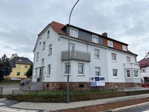 a large white building on the side of a street at Argenta Living 2 in Fulda