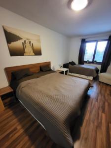 Posteľ alebo postele v izbe v ubytovaní Apartmán Lipno 50