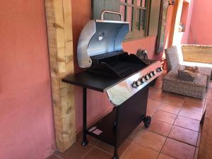 a grill sitting on a table in a kitchen at Can Companys in Maçanet de la Selva