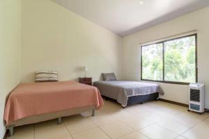 Voodi või voodid majutusasutuse Rancho Bellavista, Unique views, Pool and WiFI! toas