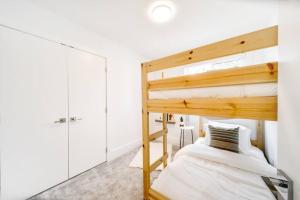 a bedroom with a bunk bed in a room at ✦Chic Haven✦3BR Near DT & WEM, King Bed, Trails, Fast Wifi, Sleeps 6! in Edmonton