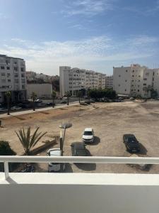 a parking lot with cars parked in a parking lot at Agadir Dreamhouse in Agadir