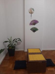 a room with two tables and two umbrellas on the wall at Apê Minimalista Melhor do Centro Self check-in in Rio de Janeiro