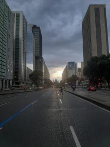 an empty street in a city with tall buildings at Apê Minimalista Melhor do Centro Self check-in in Rio de Janeiro