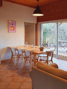 a large dining room with a table and chairs at Domaine de la Brette in Condom