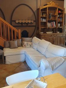 a living room with a couch and a table at Domaine de la Brette in Condom