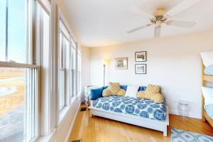 a bedroom with a bed and a ceiling fan at Sunset View in Wells