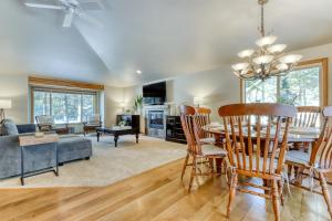 a dining room and living room with a table and chairs at Lost Rider Loop Lodge in Sunriver