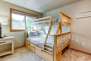 a bedroom with a bunk bed and a desk at Lost Rider Loop Lodge in Sunriver