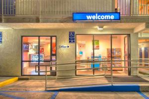 a welcome sign in front of a store at Motel 6-Mammoth Lakes, CA in Mammoth Lakes