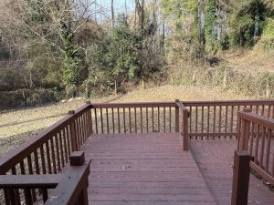 a wooden bridge with two benches on top of it at Atlanta on the Nile in Atlanta