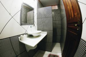 a bathroom with a sink and a mirror at Hostel Da Bruna - Botafogo in Rio de Janeiro