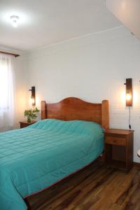 Tempat tidur dalam kamar di Casa Villarrica