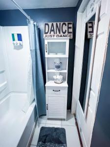 a bathroom with a shower and a sink at Modern Designed DTWN Condo with a 99 percent Walk Score in Atlanta