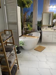 a bathroom with a bath tub and a sink at Page House Bed & Breakfast in Dublin