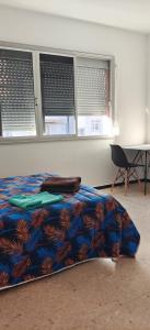 A bed or beds in a room at Lodge El Muelle Arinaga