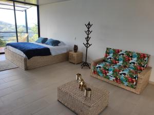 Cama o camas de una habitación en Tambo Eco Hotel
