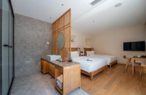 Letto o letti in una camera di Beijing Heyuan Courtyard Hotel (Forbidden City)