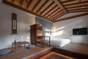 Letto o letti in una camera di Beijing Heyuan Courtyard Hotel (Forbidden City)