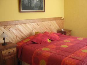 Säng eller sängar i ett rum på Hostería y Spa Llano Real