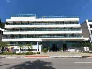 a large white building with a lot of windows at FHF Blue Suites in João Pessoa