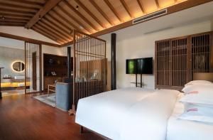 Letto o letti in una camera di Beijing Heyuan Courtyard Hotel (Forbidden City)