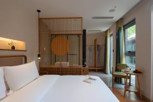 Letto o letti in una camera di Beijing Heyuan Courtyard Hotel (Forbidden City)