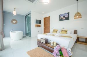 Postel nebo postele na pokoji v ubytování Caligo Resort + 43 fotografií