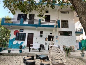 a building with a swing in front of it at Soul Haven in Rishīkesh