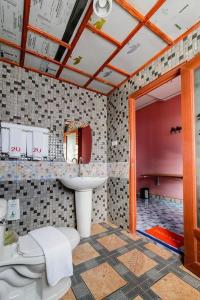 a bathroom with a toilet and a sink at 2U Hotel Hatyai in Hat Yai