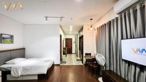 Postel nebo postele na pokoji v ubytování VNAHOMES Serviced Apartment