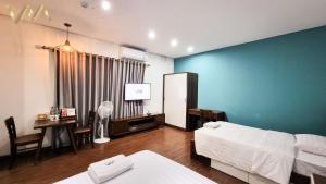 Postel nebo postele na pokoji v ubytování VNAHOMES Serviced Apartment
