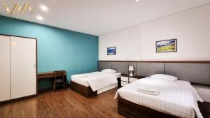 Postel nebo postele na pokoji v ubytování VNAHOMES Serviced Apartment