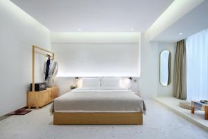 Postel nebo postele na pokoji v ubytování Sky Garden Inn
