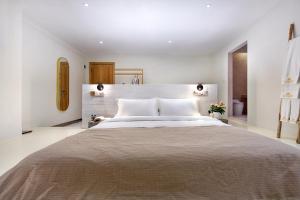 Postel nebo postele na pokoji v ubytování Sky Garden Inn