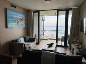 a living room with a view of the ocean at Quayside 1001 Durban Point in Durban