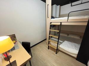 Postel nebo postele na pokoji v ubytování Formosa 101 Taipei Main Branch
