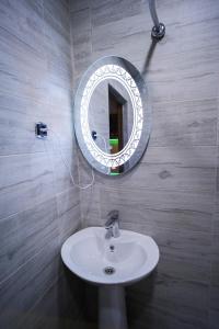 a bathroom with a sink and a mirror on the wall at VN Hotel Vanadzor in Vanadzor