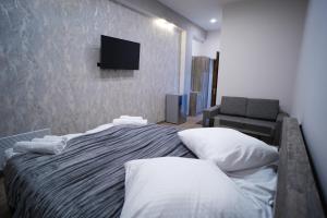 Ένα ή περισσότερα κρεβάτια σε δωμάτιο στο VN Hotel Vanadzor