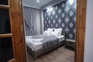 Ένα ή περισσότερα κρεβάτια σε δωμάτιο στο VN Hotel Vanadzor
