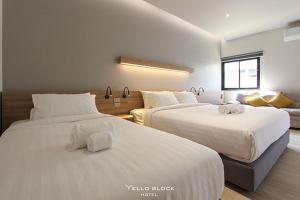 Postel nebo postele na pokoji v ubytování Yello Block Hotel