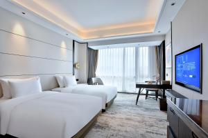 TV a/nebo společenská místnost v ubytování 银都酒店 Yandoo Hotel