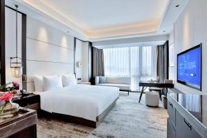 TV a/nebo společenská místnost v ubytování 银都酒店 Yandoo Hotel